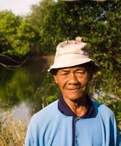 Gardener Uncle It by the fish pond at Faa Sai farm